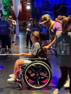 Girl in wheelchair having fun at the party